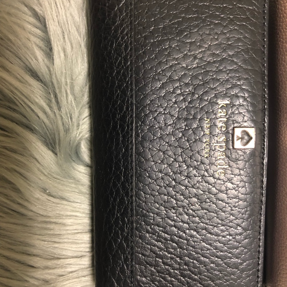 Kate spade black bi fold wallet .